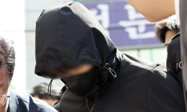 7일 광주 동구 광주지방법원으로 이동하는 ‘묻지마 살인’ 피의자 장모 씨. 연합뉴스